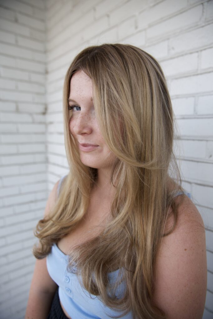 Honey-lit blonde balayage with lived-in grow-out at Vakkar Salon St. Louis